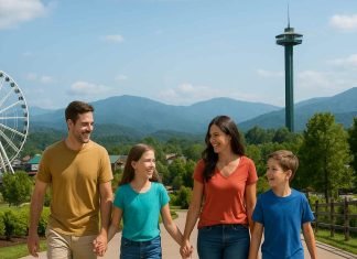 The Ultimate Guide to Planning a Fun-Filled Family Vacation to Pigeon Forge Family walking in Pigeon Forge with mountains and attractions behind them.