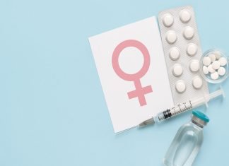 Hormone Replacement Therapy: What to Do When It’s Not Working as Expected HRT supplies with female symbol card on blue background.