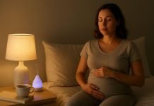 5 Natural Treatments for Pregnancy Insomnia Pregnant woman relaxing in bed at night with herbal tea
