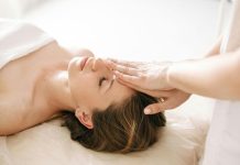 Simple Self-Care Habits Every Mom Can Fit Into Her Busy Day Woman receiving gentle Reiki or energy healing therapy at a spa.