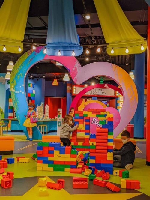 Children playing with oversized LEGO blocks at LEGO Discovery Center Atlanta.