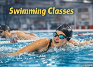 Swimming classes session with swimmer performing freestyle in pool